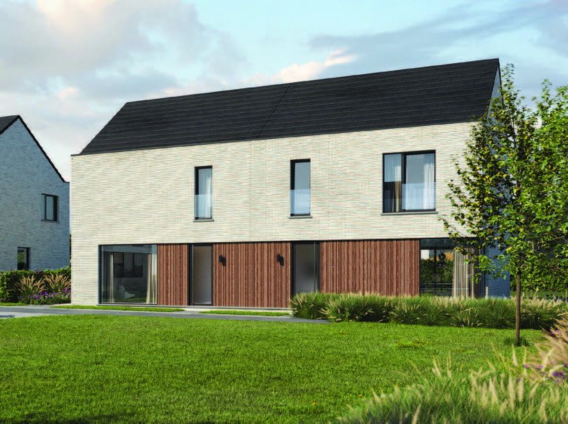 Ruime en energiezuinige nieuwbouwwoning op een zuidelijk georiënteerd perceel van 254m2. Op het gelijkvloers is een inkom met gastentoilet, een waspla