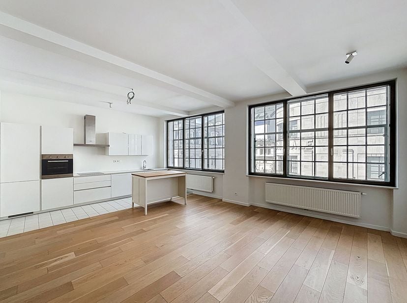Centre de Bruxelles - Cet appartement luxueux d&#039;une chambre + bureau de 117m², situé dans un emplacement idéal en plein cur de Bruxelles, offre le par