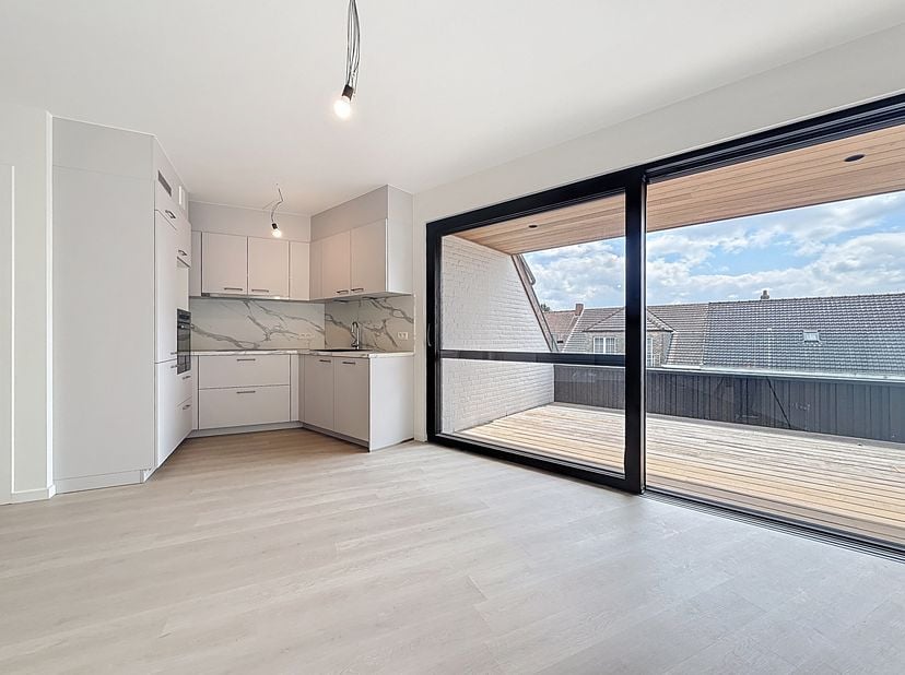 Dit gloednieuwe appartement, gelegen in het energiezuinige nieuwbouwproject &quot;Daniël &amp; Zozima&quot; in de Baanstknokstraat 1 te Waregem, biedt het beste van