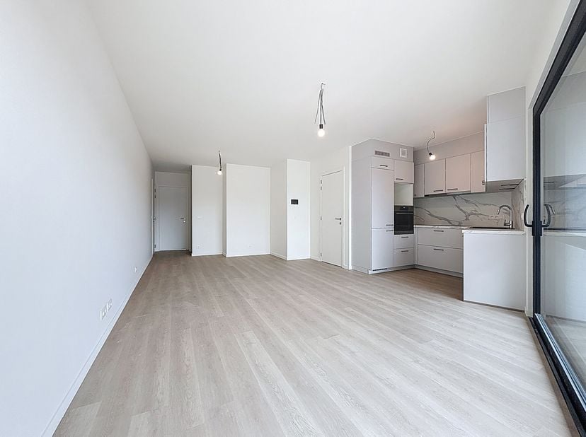 Dit gloednieuwe appartement, gelegen in het energiezuinige nieuwbouwproject &quot;Daniël &amp; Zozima&quot; in de Baanstknokstraat 1 te Waregem, biedt het beste van