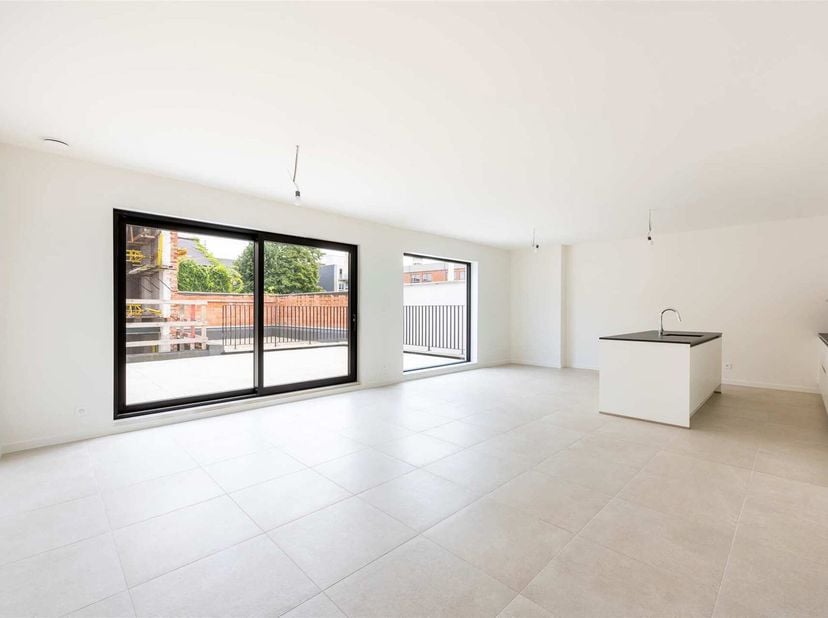 Nieuwbouw appartement in trendy wooncomplex gelegen in centrum Sint-Niklaas.&lt;br /&gt;
Het appartement is gelegen op de 1e verdieping en is te bereiken vi