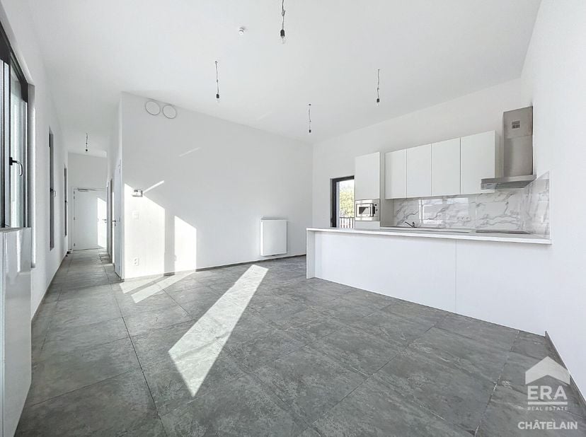 ERA CHATELAIN vous propose ce superbe appartement neuf idéalement situé entre le lAbbaye de Forest et le Parc du Bempt à Forest dune surface de 78m² (