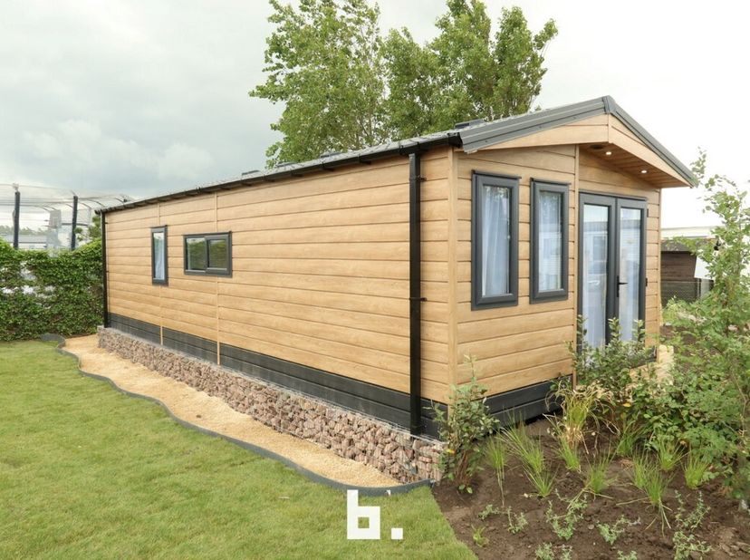 Nieuwe chalet (type Comfort) op topligging vlak aan zee te Wenduine met mooie living met aansluitend terras, open ingerichte keuken, gasten toilet, ba