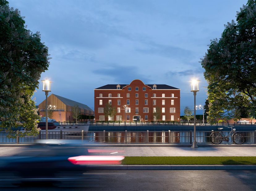 Vandaag herrijst hier, langs het Kanaal, tegenover het Koninklijk Domein van Laeken, en geflankeerd door Docks Bruxsel, het project UTOPIA. Het archit