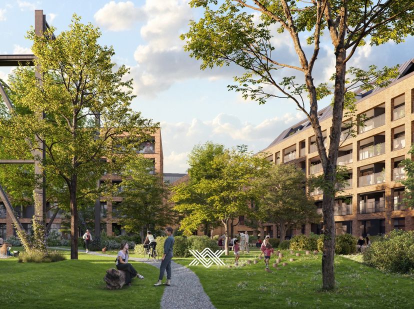 Dit tweeslaapkamer appartement van 97 m² beschikt over een lichtrijke leefruimte met hoge plafonds en rechtstreekse toegang tot het zuidwest gericht t