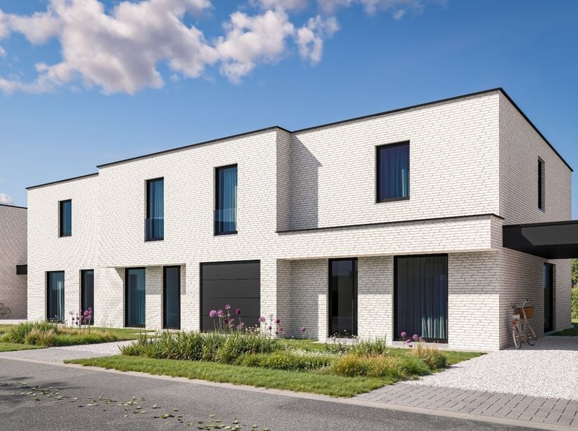 Op het gelijkvloers is deze moderne woning voorzien van een inkomhal met een apart gastentoilet, een ruime leefruimte die overgaat in de open keuken.