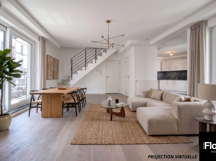 In de nabijheid van het Colignonplein biedt FLOW Real Property dit prachtige duplexappartement met twee slaapkamers van 125 m² (volgens EPC) en twee t