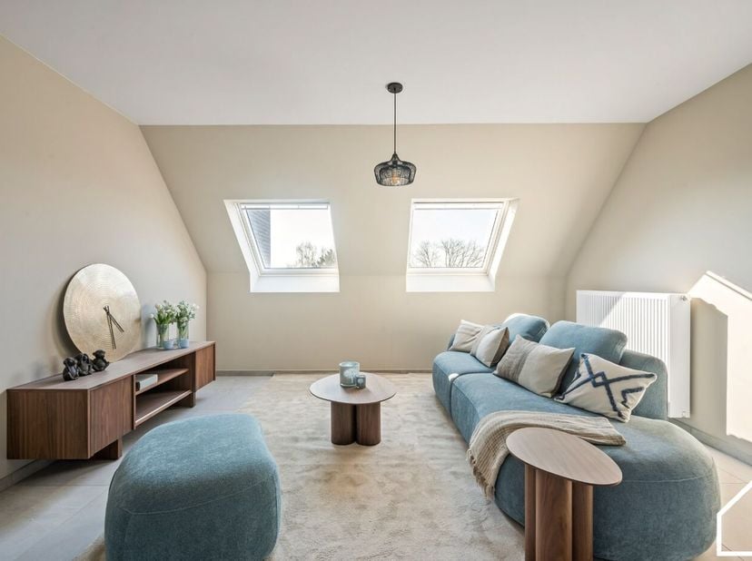 Appartement op de 3e verdieping van 88,96 m² bestaande uit een inkomhal met vestiaire, toilet en douchekamer, woonkamer met open keuken, wasruimte en