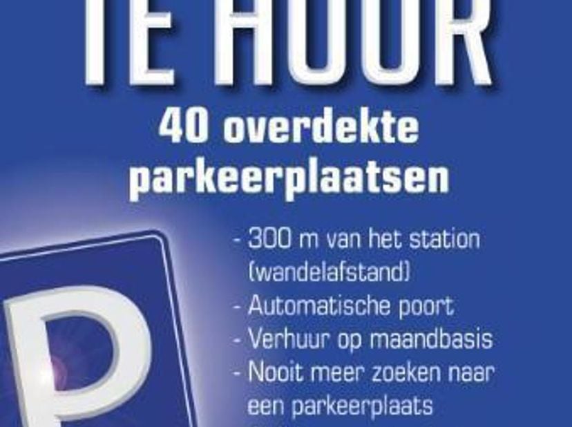 OVERDEKTE EN AFGESLOTEN AUTOSTAANPLAATS IN VERNIEUWDE HANGAR 1100m2. Op slechts 300m van het Station van Geraardsbergen : een oplossing om jouw auto v