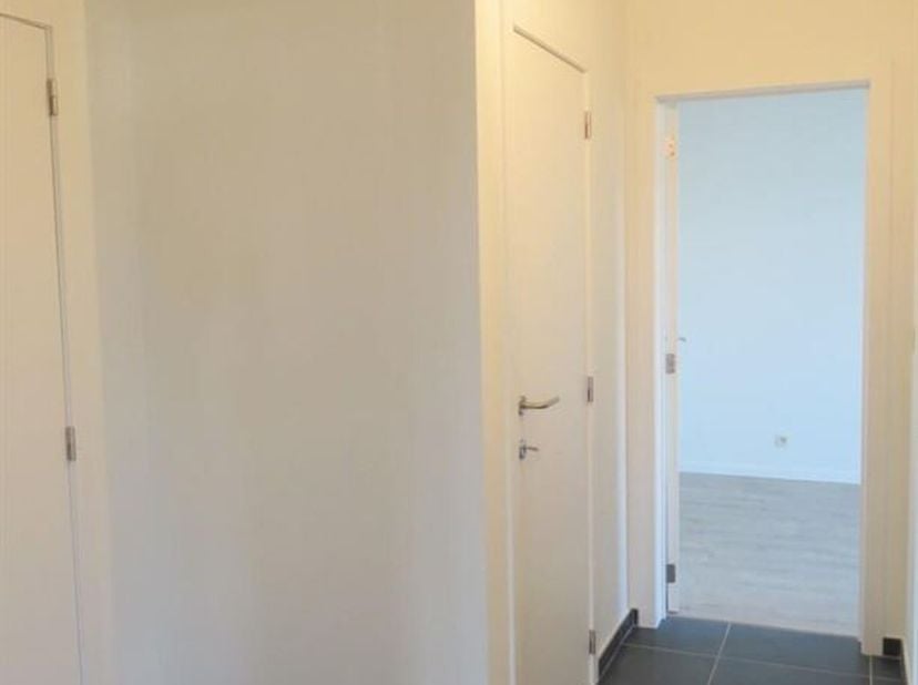 Bel appartement de plain-pied avec terrasse et place de parking souterraine<br />
Situation : Situé au coeur d'un quartier calme près du centre de Her