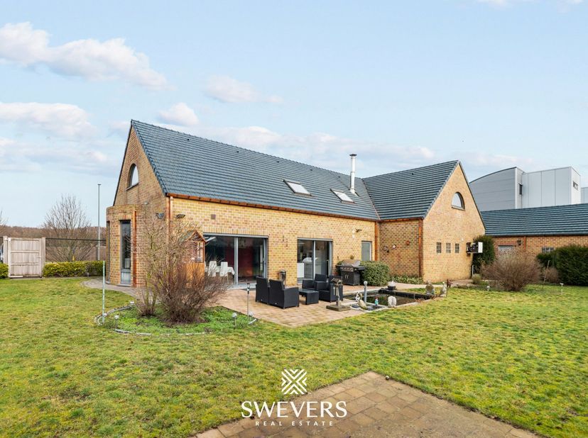Interesse? Meer informatie op www.SWEVERS.be. - Deze instapklare open bebouwing in de Bieststraat 170 te Heusden-Zolder (bouwjaar 1993) biedt een idea