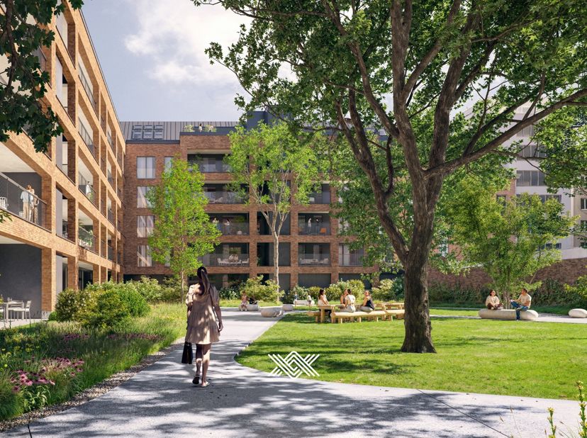 Dit hoekappartement van 71 m² is geleden op de 4de verdieping en beschikt over een bijzonder lichtrijke eet- en leefruimte met extra hoge plafonds van