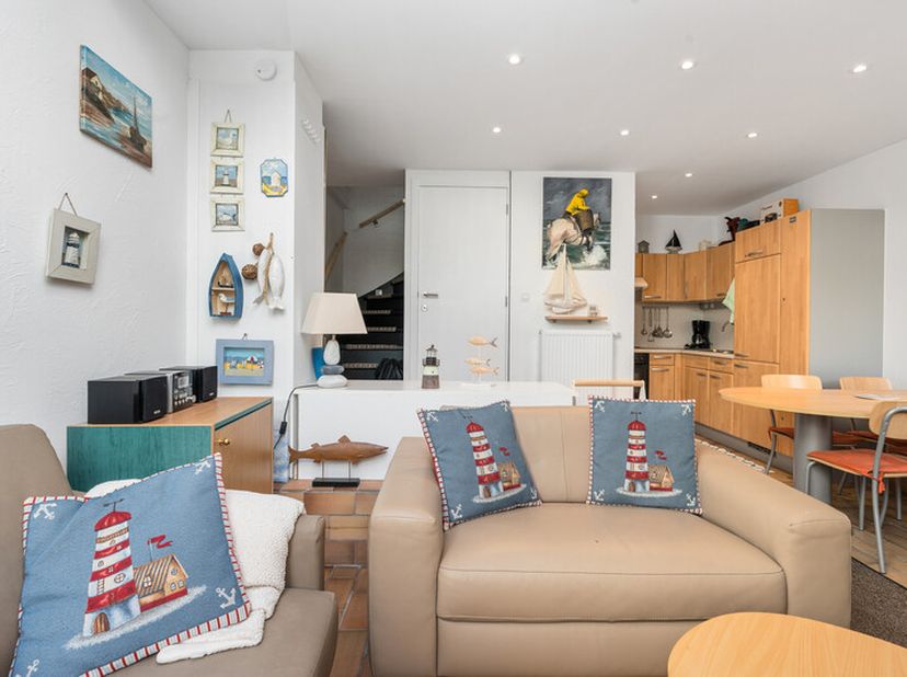 Maison de vacances chaleureusement aménagée avec 1 chambre, terrasse, petit jardin et emplacement de parking, située dans un domaine de vacances calme