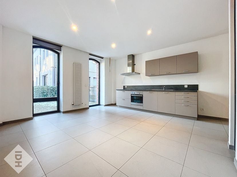 Appartement rez-de-chaussée, 1 chambre avec terrasse à Tournai à louer.<br />
Dans la résidence de qualité basse consommation L'Îlot Desclée, découvre