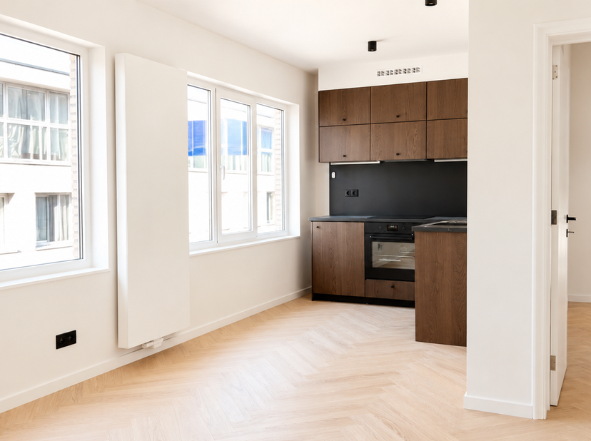 Dit gerenoveerde 1-slaapkamerappartement van ca 52 m² bevindt zich op de derde verdieping van een volledig gerenoveerd appartementsgebouw in het hart