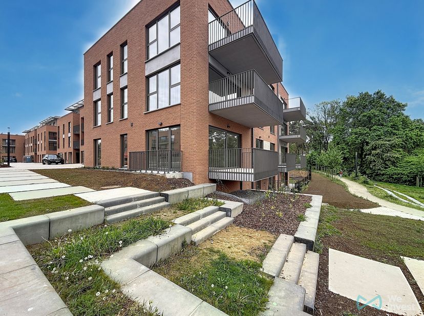 Prachtig nieuwbouwappartement op de gelijkvloerse verdieping, ideaal gelegen te Ottignies-Louvain-la-Neuve in de gegeerde wijk Courbevoie, op wandelaf