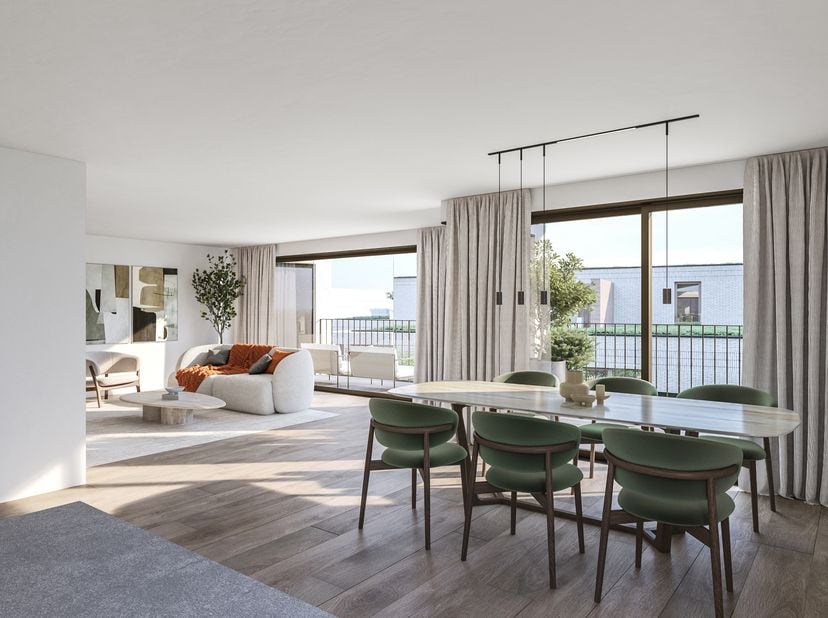 Ruim 2 slaapkamer appartement op het gelijkvloers. Voorzien van een mooie leefruimte met aansluitend terras en zicht op de gemeenschappelijke groene t