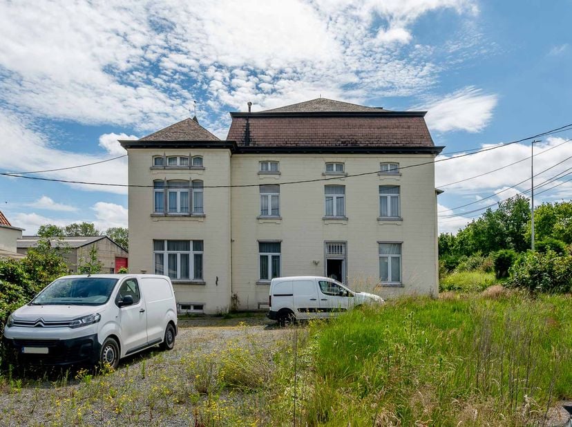 23046 Gemeente Beersel, vijfde afdeling, Lot Een woning, met boomgaard en een magazijn, op en met grond en aanhorigheden, gestaan en gelegen te Beerse