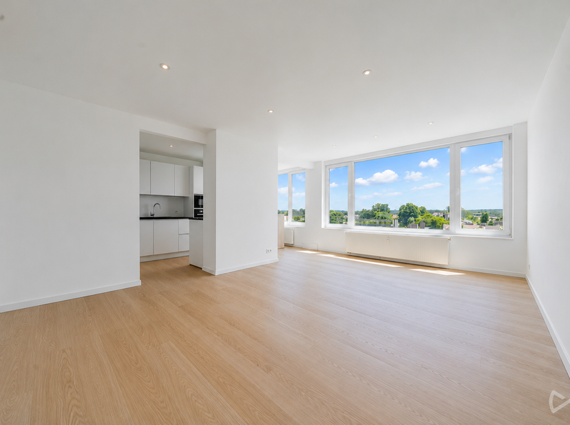 Septième étage, vue dégagée, entièrement rénové : cet appartement parle de lui-même. Perché au-dessus des toits d'Auderghem, avec un balcon accessible