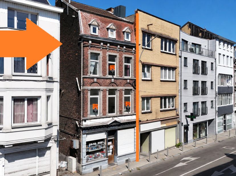 Idéalement située au centre du quartier dAmercoeur (Liège), maison de commerce et d'habitation (+/- 325m² d'après plans) pouvant être affectée en comm