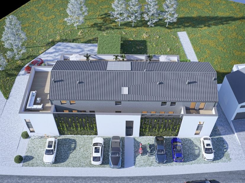ERA BLUX biedt u dit nieuwbouwappartement met 2 slaapkamers en een bewoonbare oppervlakte van 90 m² aan, gelegen op de eerste verdieping van een moder