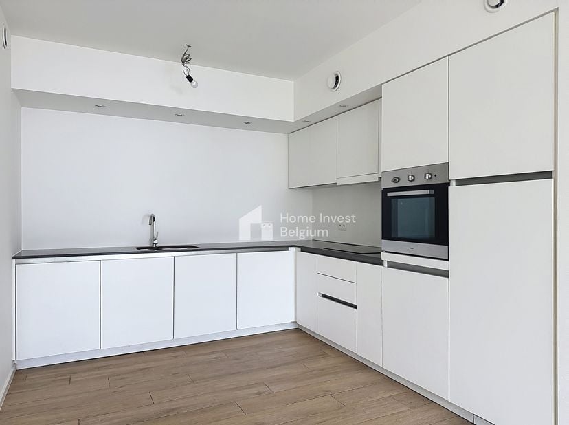 En plein cœur de Bruxelles, dans le quartier Brunfaut, Home Invest Belgium a réussi le pari de reconvertir un ancien site semi-industriel en logement