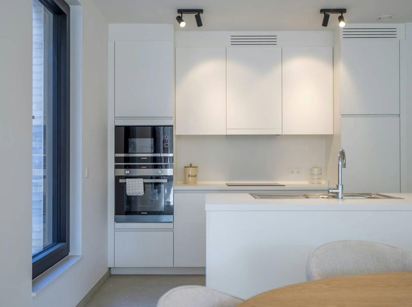 Cet appartement de nouvelle construction fait partie de la résidence Sint-Amandus, située à l'angle de la Kortrijkstraat et de la Harelbeekstraat, prè