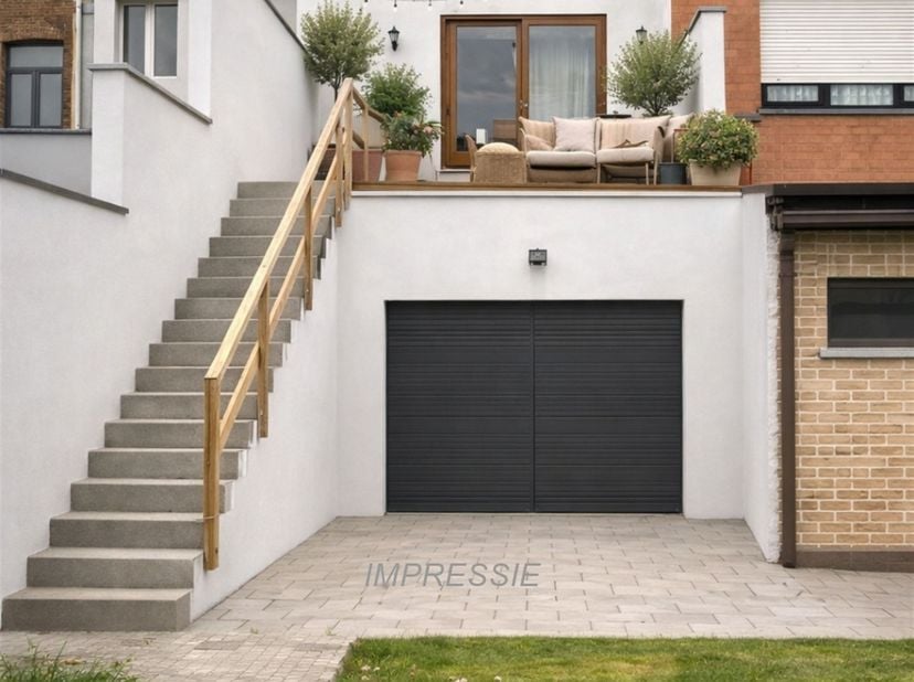 Bel-etage met atelier, tuin én garage in Mechelen<br />
Op het gelijkvloers vind je een ruime garage met elektrische sectionaalpoorten aan zowel de v