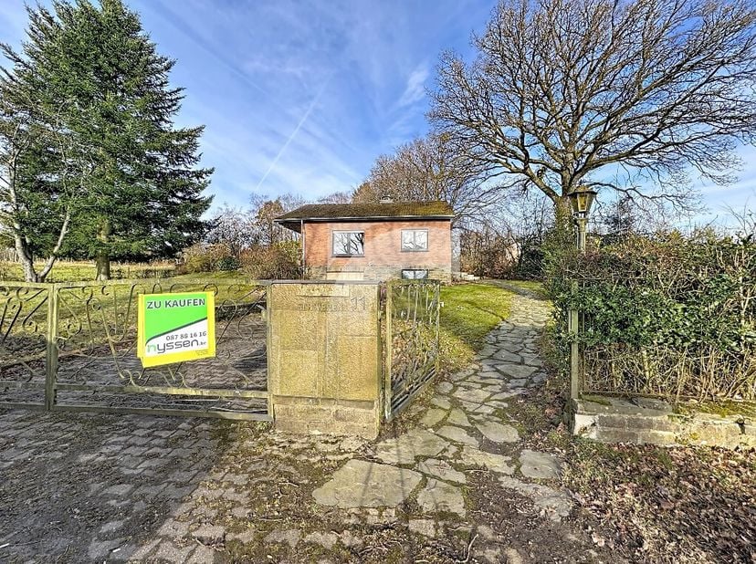 Raeren Weserbergstraße, 11: Nichée dans un environnement idyllique, au calme et à labri des regards, cette maison des années 1970 offre un cadre de vi