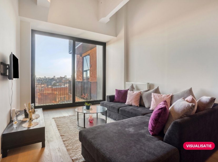 Appartement loft d'une chambre (75m²) à vendre dans un ancien bâtiment d'usine situé à Anderlecht. Le bâtiment a été transformé en lofts et achevé en