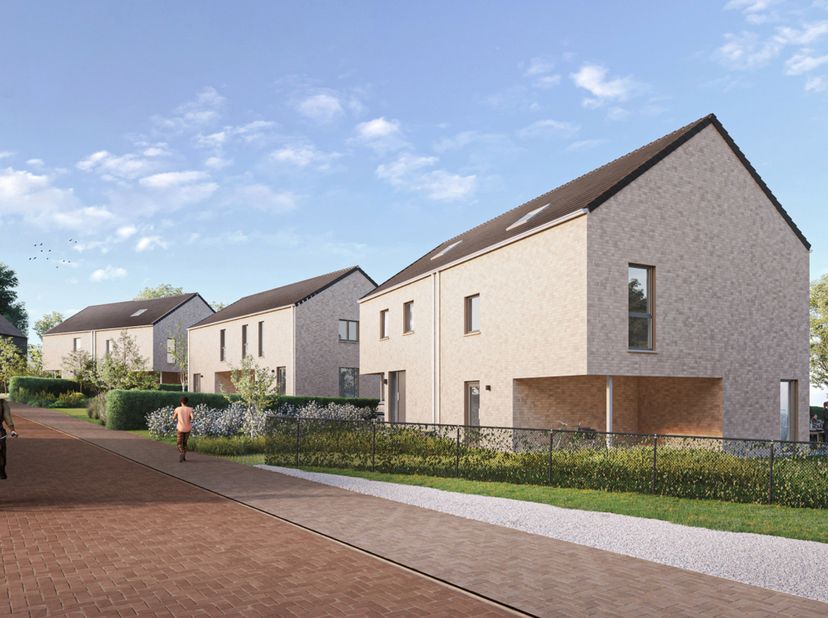 VALIMMAS verkoopt deze mooi gelegen nieuwbouw driegevelwoning met carport en grote tuin...   <br />
<br />
Het gelijkvloers bestaat uit een inkomhal,