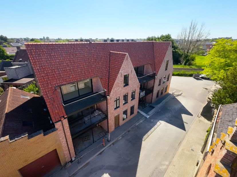 Residentie 'Het zonnig hoekje' verwijzend naar het klein naambordje die op de oorspronkelijk site aan de voorgevel van de woning ging, heeft zijn naam