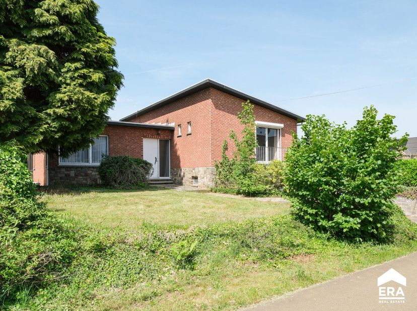 À vendre: maison 4 façades située Zwaluwstraat à Lummen, dans un endroit calme tout en étant proche des accès à lE314/E313. Cette propriété offre un g
