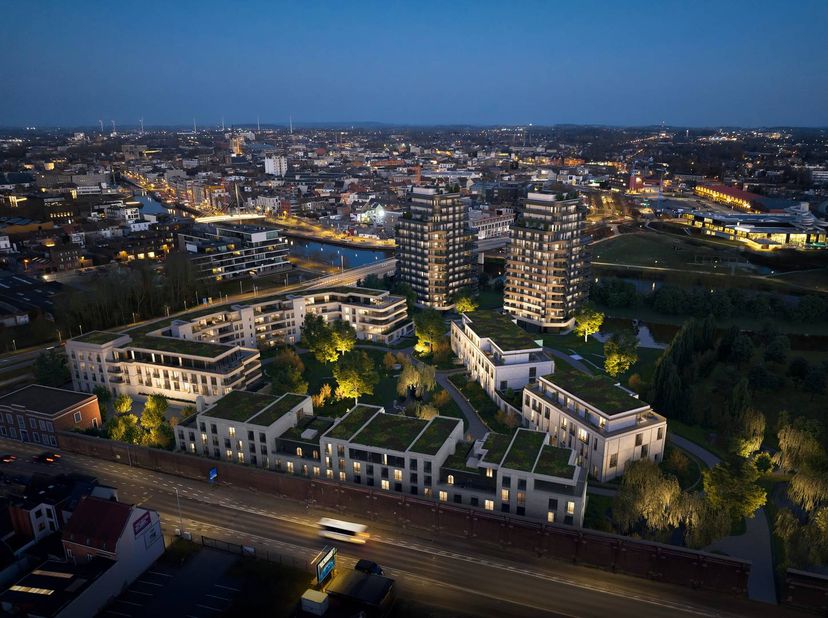 Dit project combineert iconische architectuur met een toplocatie aan de oevers van de Leie, op wandelafstand van het bruisende centrum van Kortrijk. <