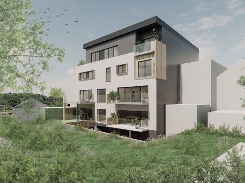 Situé au premier étage, l'appartement 1.2 est composé d'un hall d'entrée avec wc indépendant, d'un lumineux séjour avec espace cuisine et accès direct