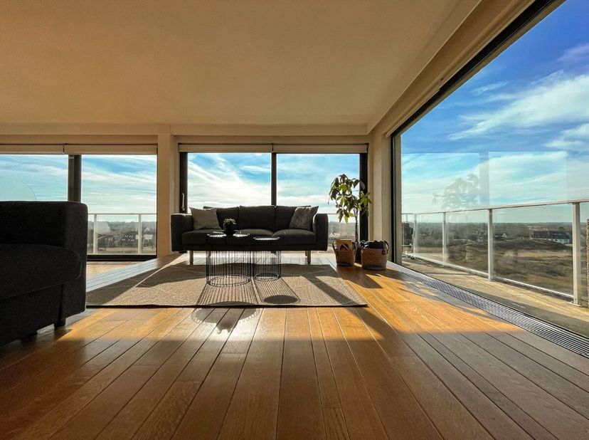 De Panne: Uniek appartement met adembenemend zicht op duinen en zee Bent u op zoek naar een uniek appartement met panoramisch uitzicht op de duinen én