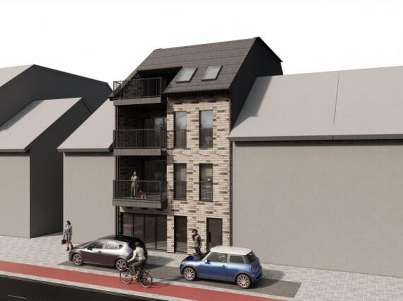 Projectgrond voor drie nieuwe appartementen, grote handelszaak met magazijn, vier bestaande garages en plaats voor negen autostaanplaatsen IN CENTRUM