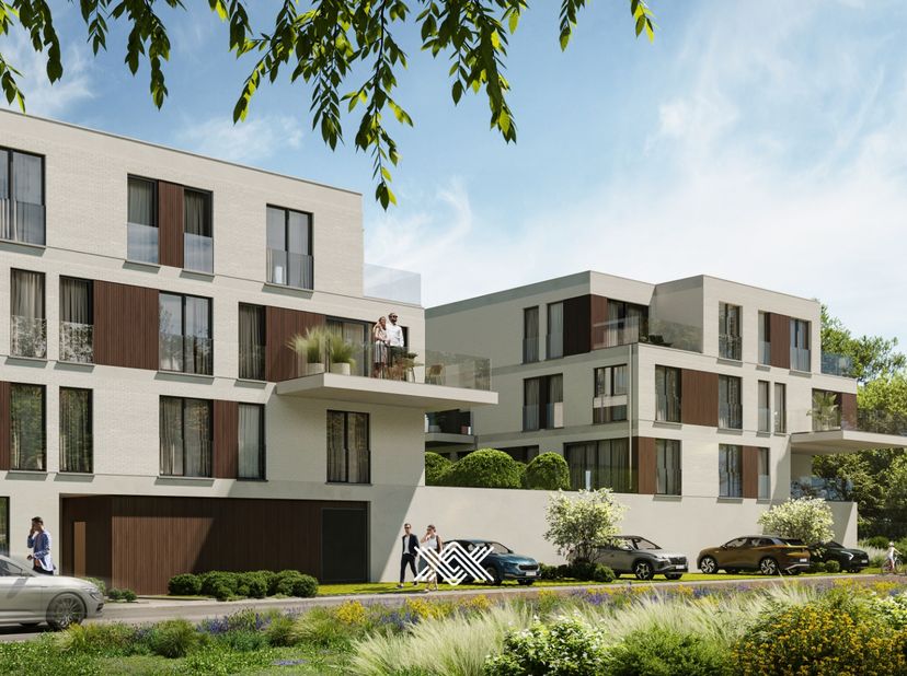 Dit tweeslaapkamer appartement van 86,9 m² op het tweede verdiep beschikt over een inkomhal, een lichtrijke leef- en eetruimte met open keuken en keuk